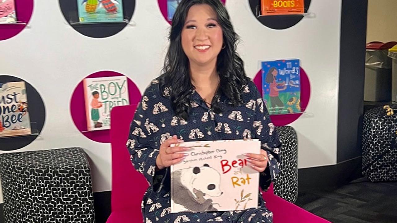 Kathy Pham holding a book for the ABC Education Story Time series